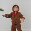 Walking toddler wearing the Gingerbread Sherpa Romper