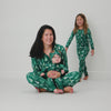 Mother and two children wearing matching Twinkling Trees pajamas