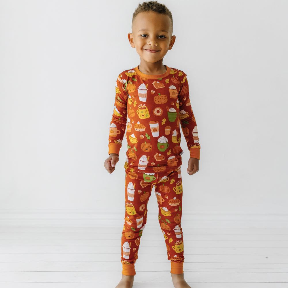 Child wearing a Pumpkin Spice two-piece pajama set