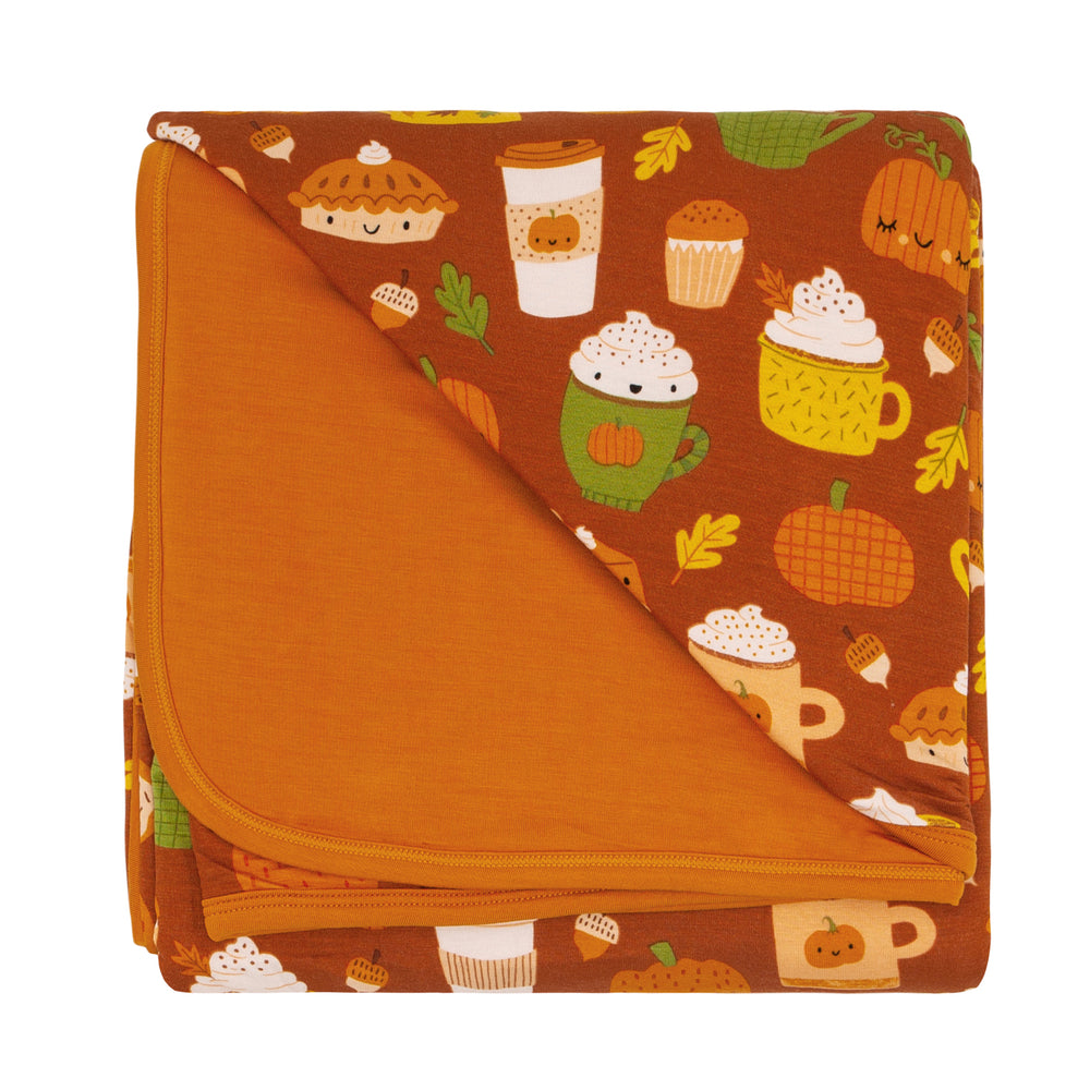 Flat lay image of a Pumpkin Spice large cloud blanket