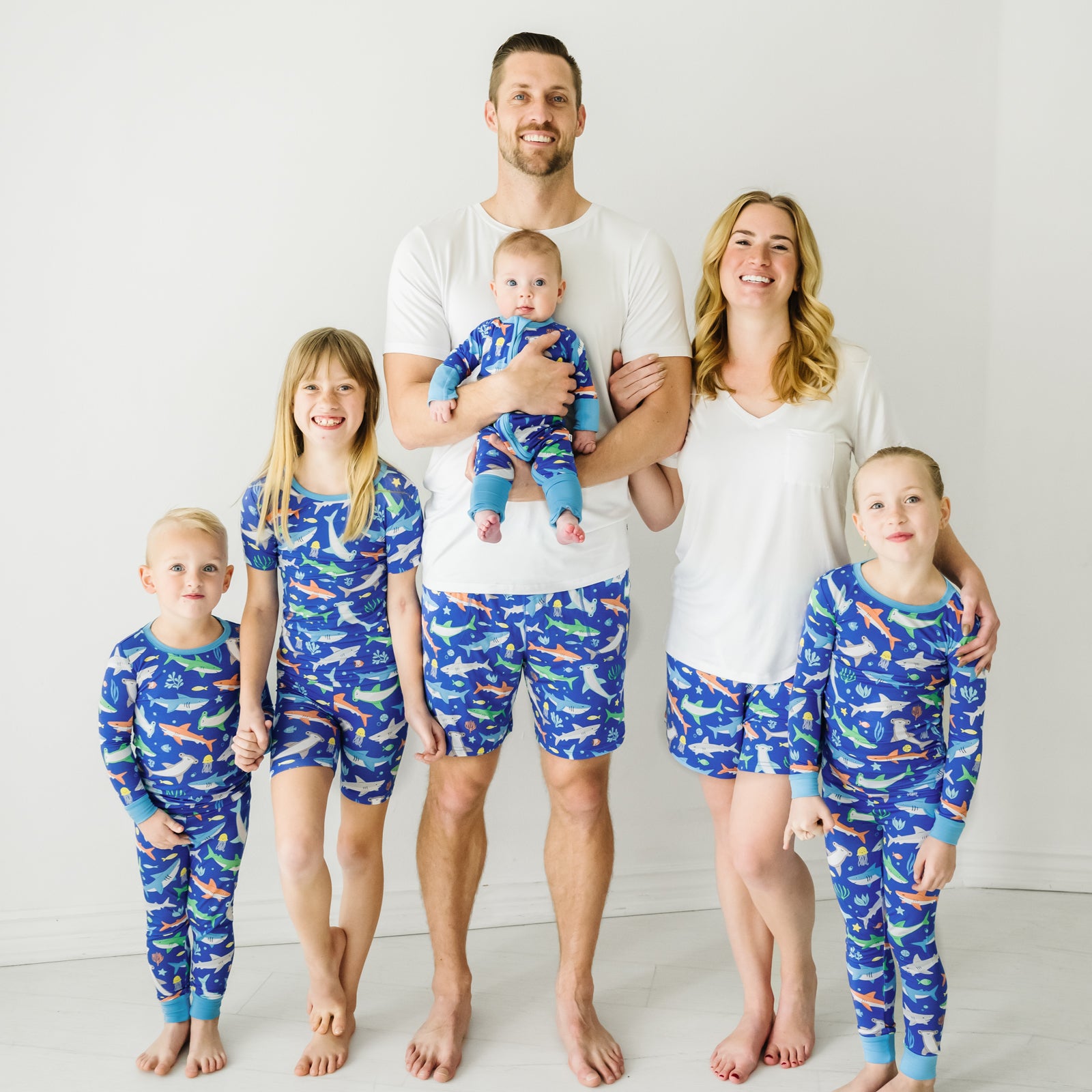 Family of six wearing matching Rad Reef pajamas