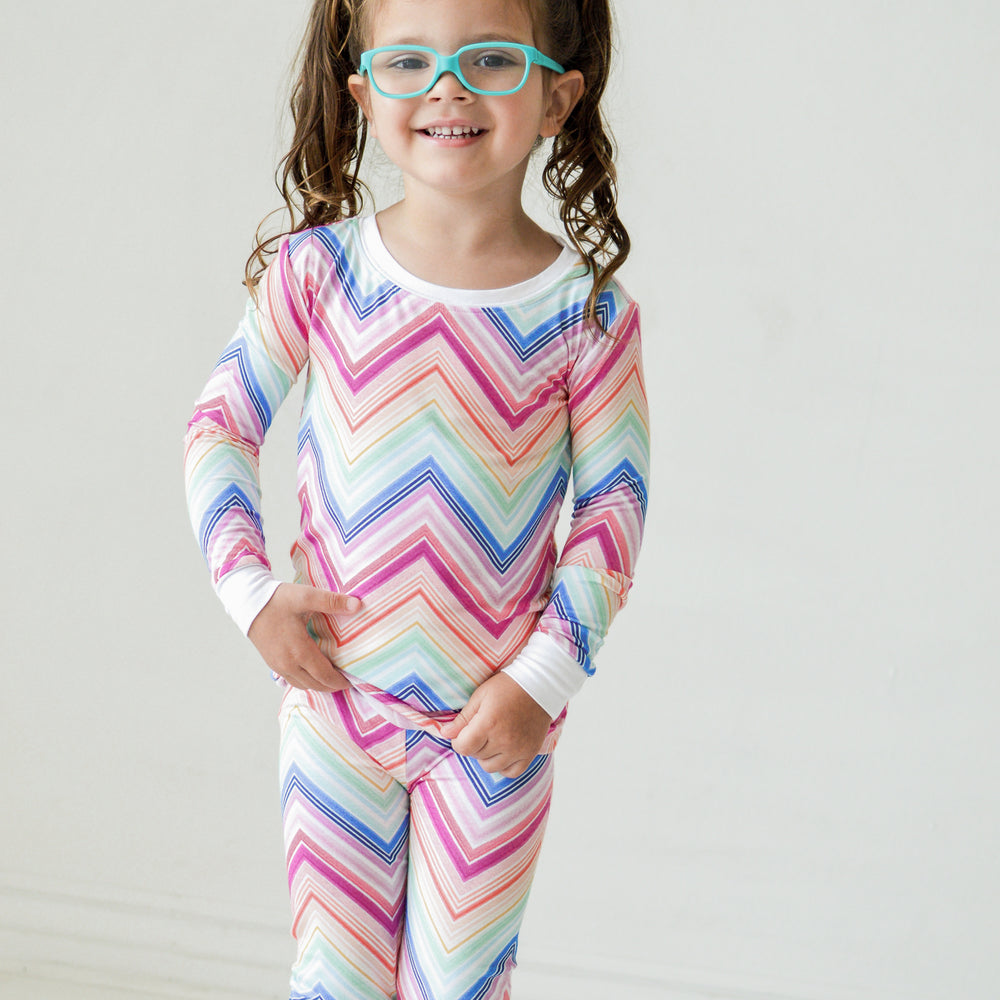 Alternate image of a child wearing a Rainbow Chevron printed long sleeve pajama set