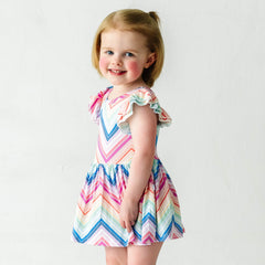Child wearing a Rainbow Chevron printed flutter sleeve skater dress with bodysuit