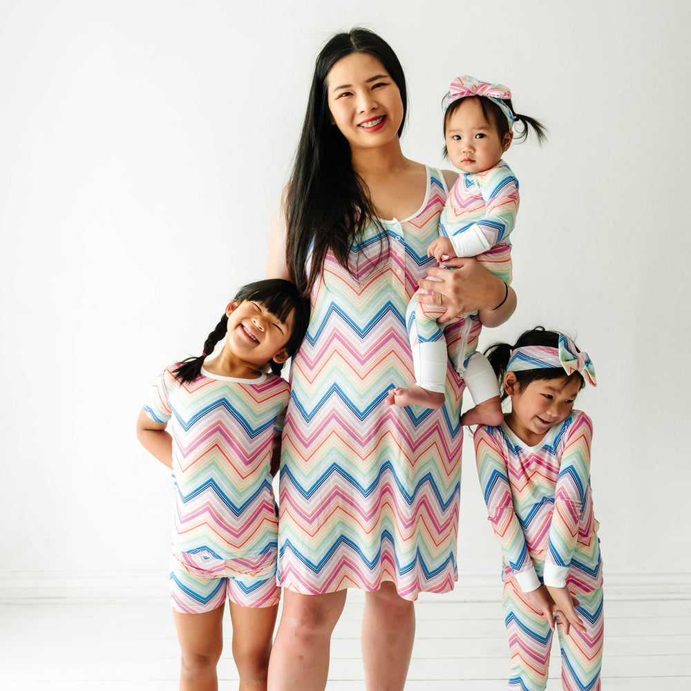 Family wearing matching Rainbow Chevron printed pajamas