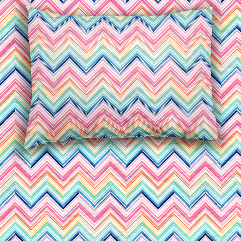 Top view of a Rainbow Chevron printed fitted twin sheet set with a matching pillow