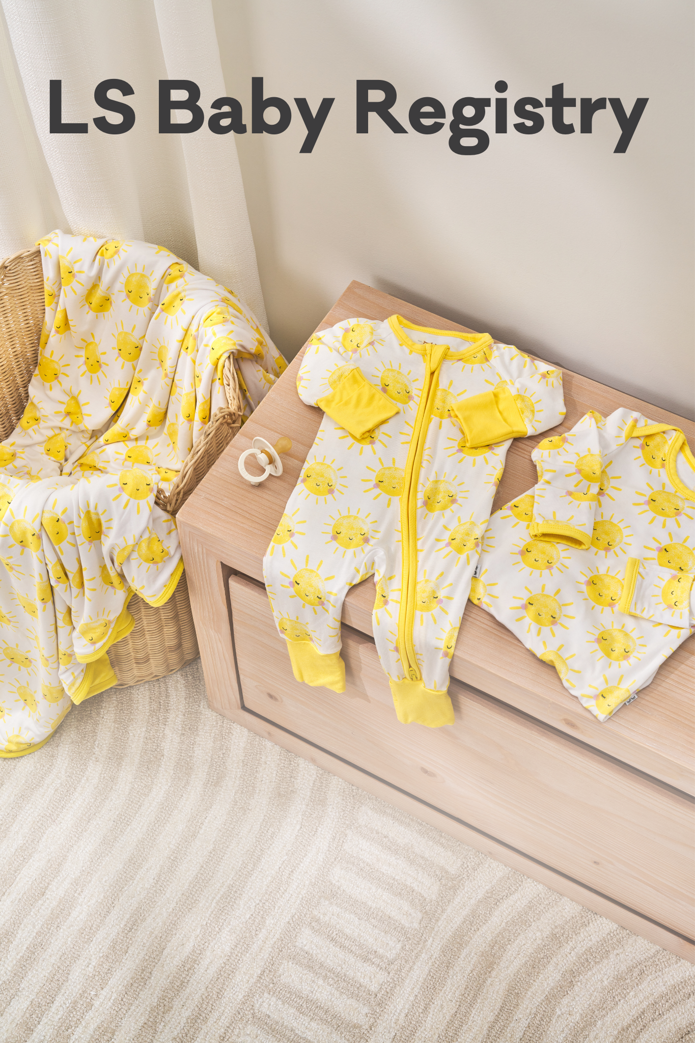 Sunshine Large Cloud Blanket, Zippy, and Infant Gown laying across a bassinet and dresser