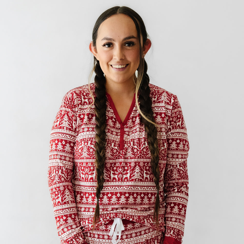 Close up image of a woman wearing Reindeer Cheer pajama top
