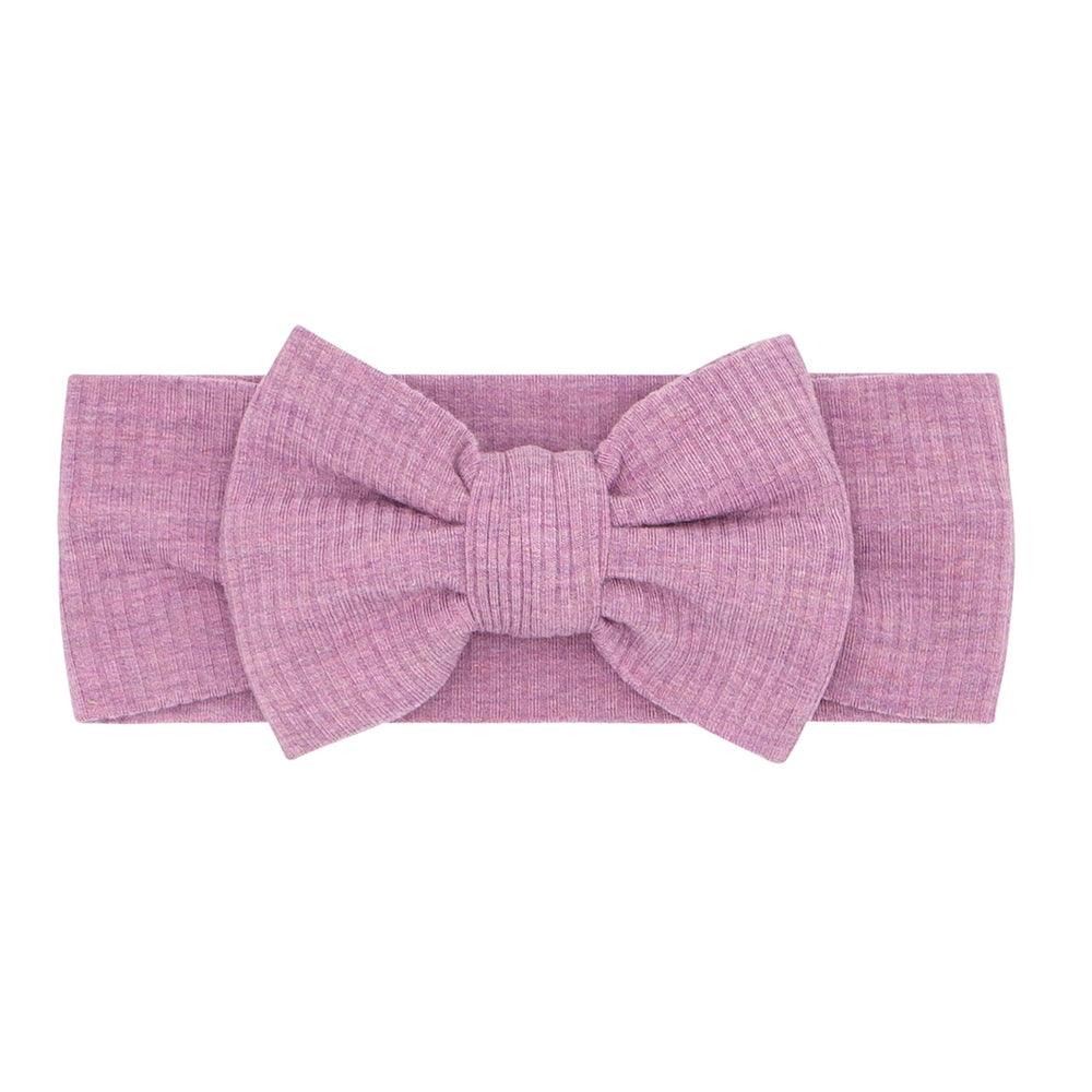 Flat lay image of a Heather Mulberry ribbed luxe bow headband