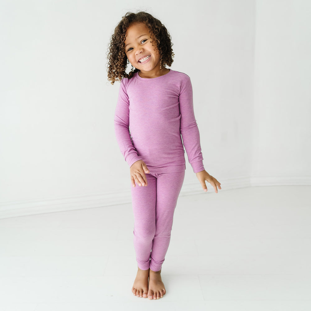 Child wearing a Heather Mulberry ribbed two piece pajama set
