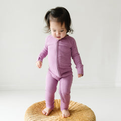 Child wearing a Heather Mulberry Ribbed zippy