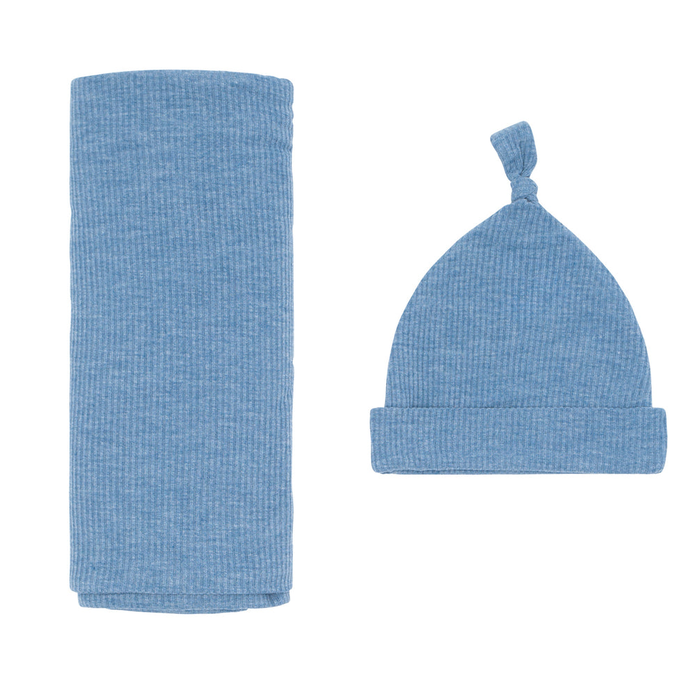Flat lay image of a Heather Blue Ribbed swaddle and hat set