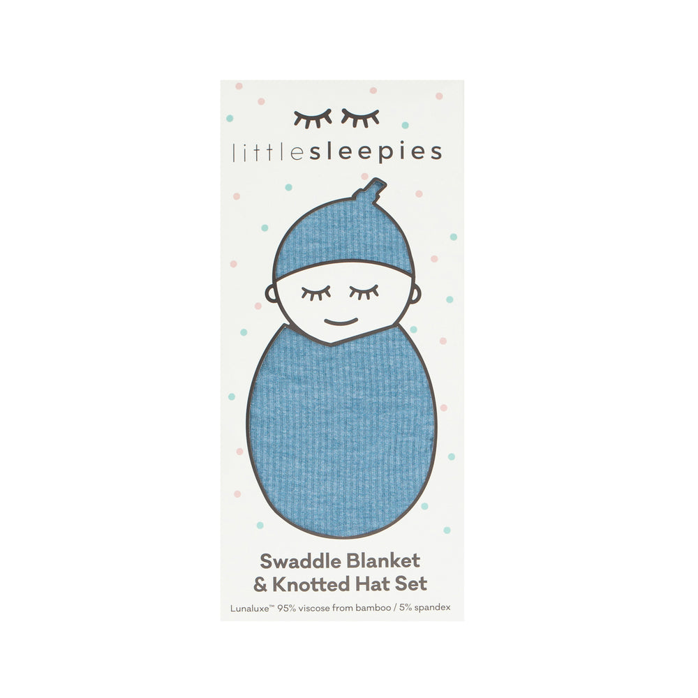 image of a Heather Blue Ribbed swaddle and hat set in Little Sleepies peek a boo packaging 