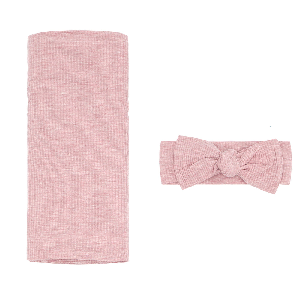 Flat lay image of a Heather Mauve Ribbed swaddle and luxe headband set