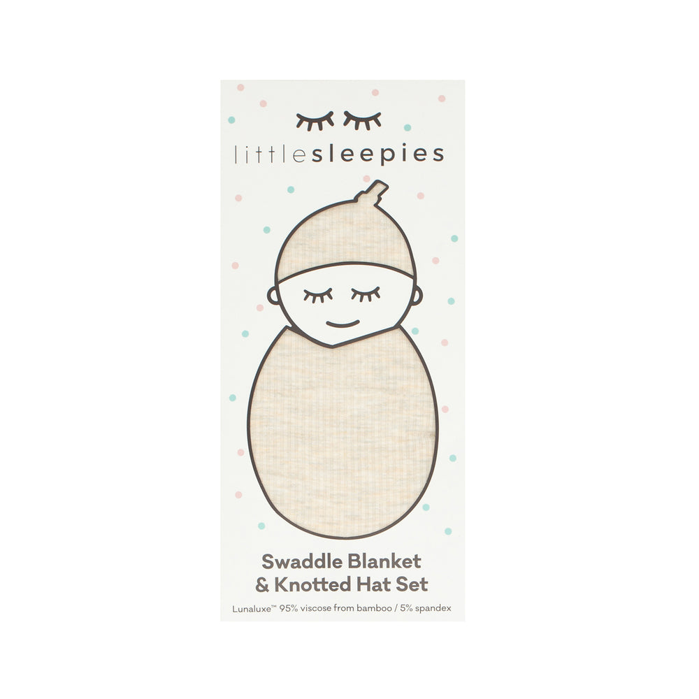 image of a Heather Oatmeal Ribbed swaddle and hat set in Little Sleepies peek a boo packaging