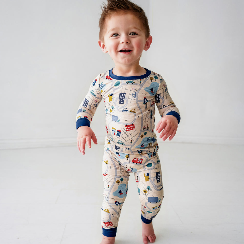 Click to see full screen - Child wearing a Blue Road Trip two piece pajama set