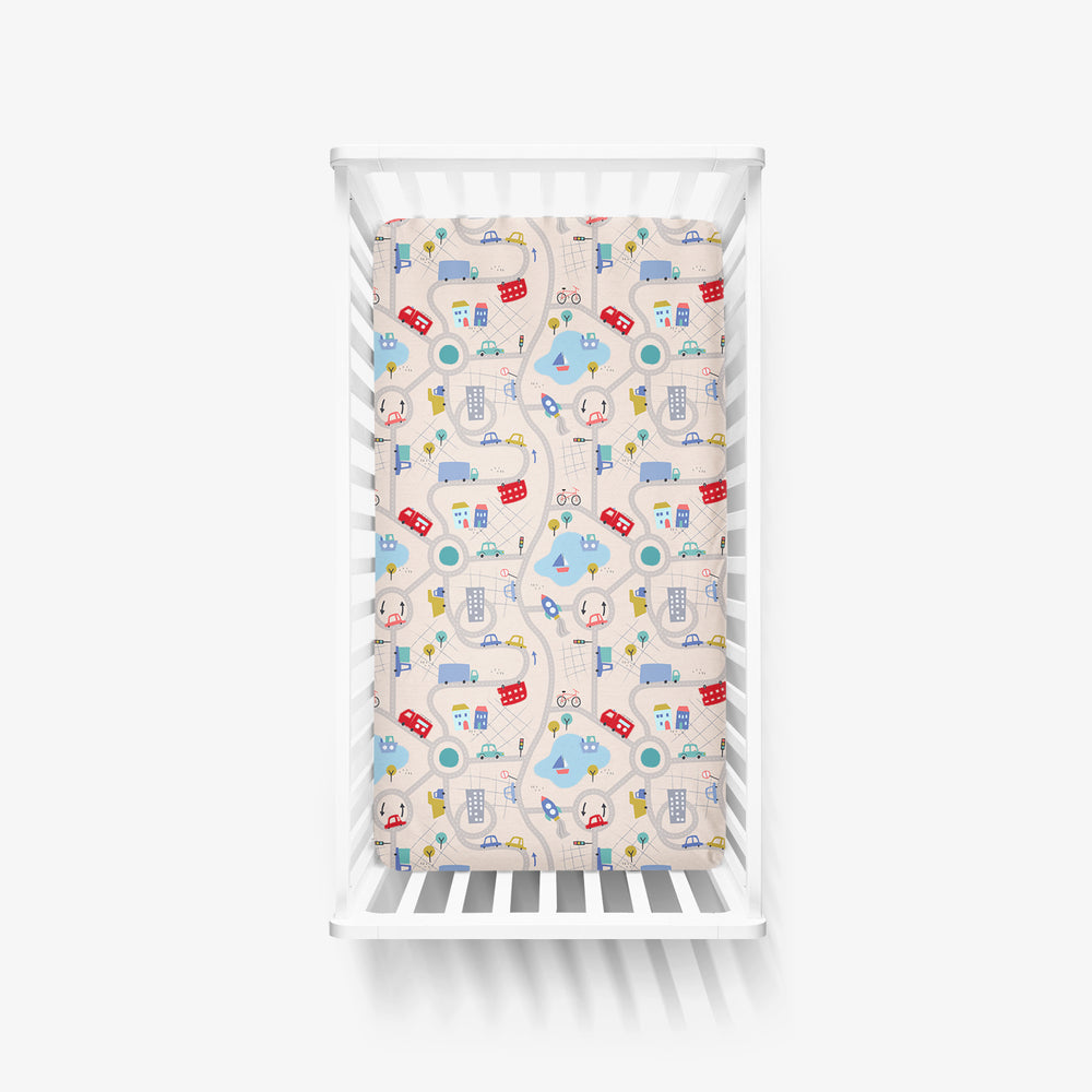 Click to see full screen - Top view of Road Trip Fitted Crib Sheet in a white crib
