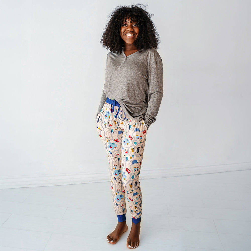 Click to see full screen - Woman wearing Blue Road Trip women's pajama pants paired with a women's Heather Gray pajama top