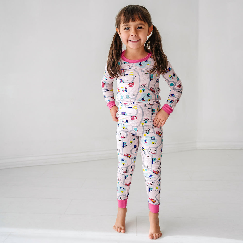 Click to see full screen - Child wearing a Rosy Road Trip two piece pajama set