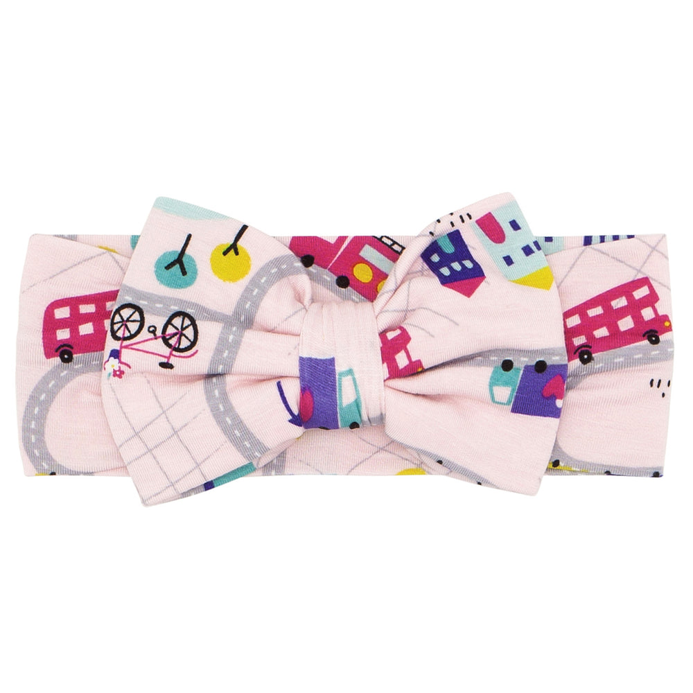 Click to see full screen - Flat lay image of a Rosy Road Trip luxe bow headband
