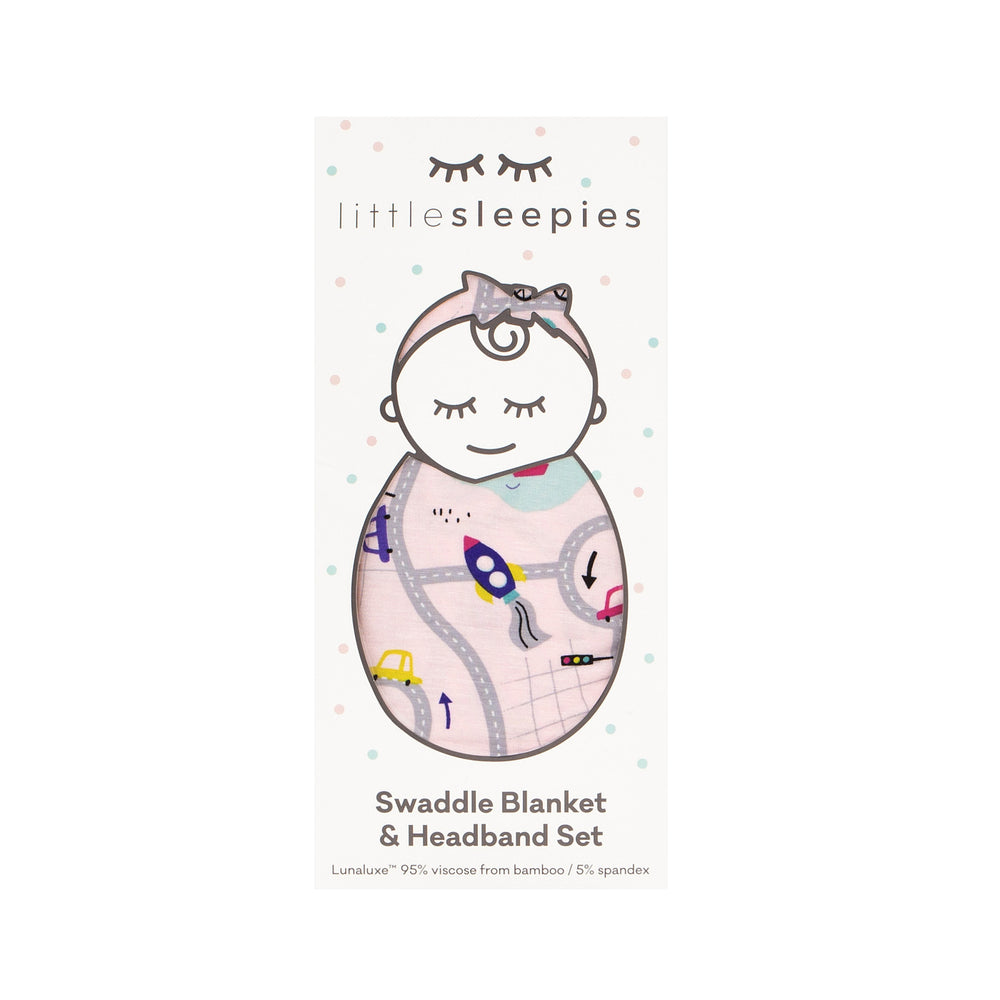 Click to see full screen - image of a Rosy Road Trip swaddle and luxe bow headband set in Little Sleepies peek a boo packaging