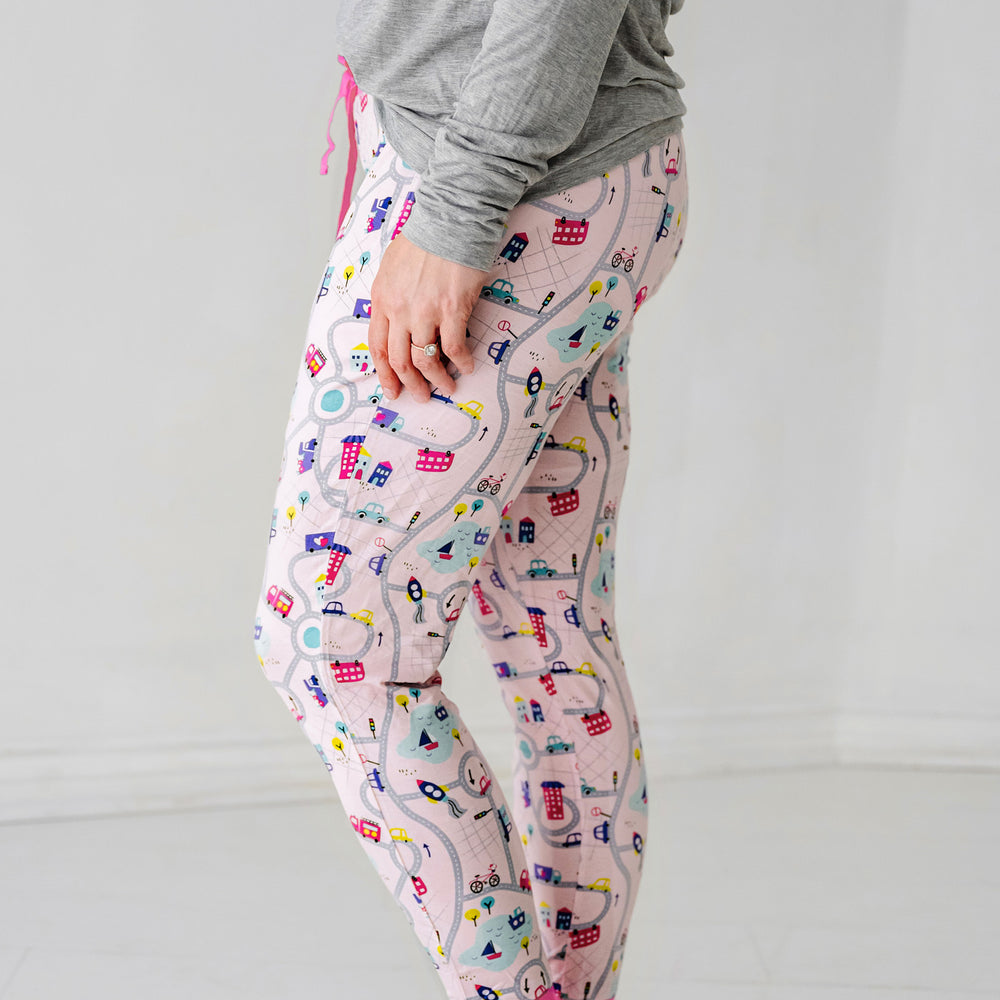 Click to see full screen - Profile view of a woman wearing Rosy Road Trip women's pajama pants