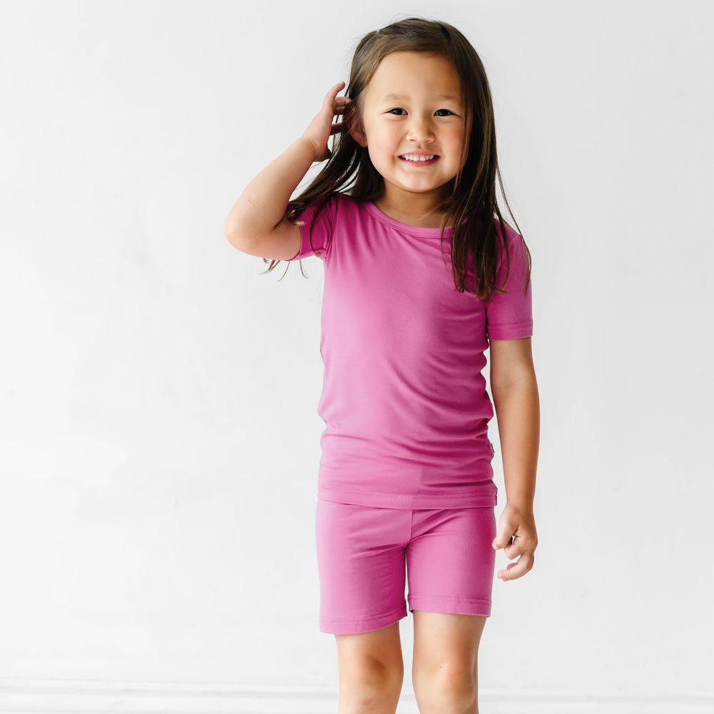 Click to see full screen - Child wearing a Rosette two piece short sleeve and shorts pajama set