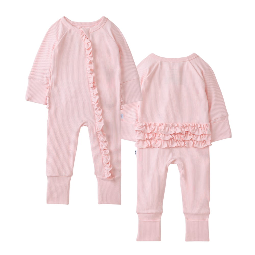 Pink baby romper with ruffled details on a white background