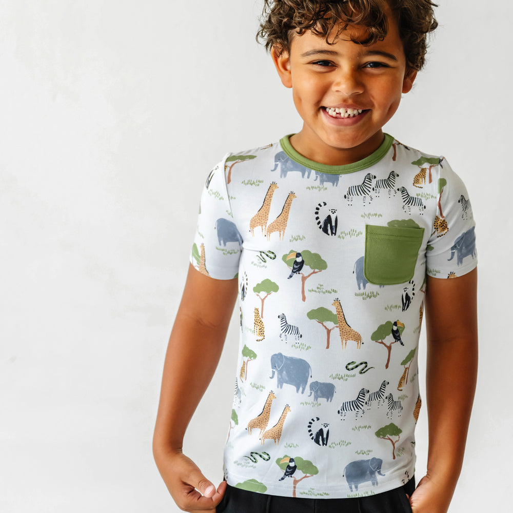 Click to see full screen - Child wearing a Safari Friends printed pocket tee