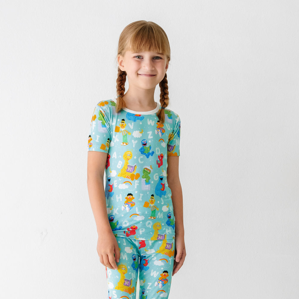 Alternate image of a child wearing a Spelling with Sesame Street two piece pajama set