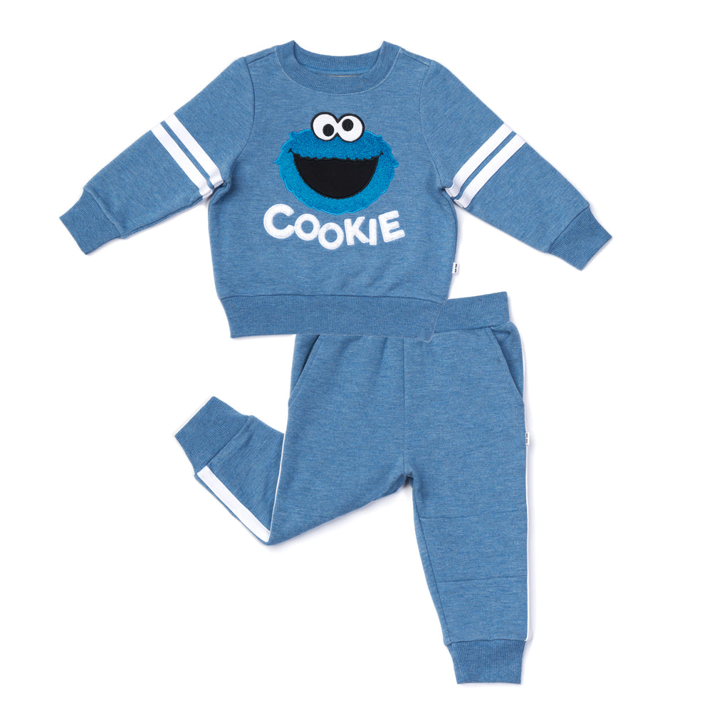 Flat lay image of a Sesame Street Cookie Monster crewneck sweatshirt and jogger set