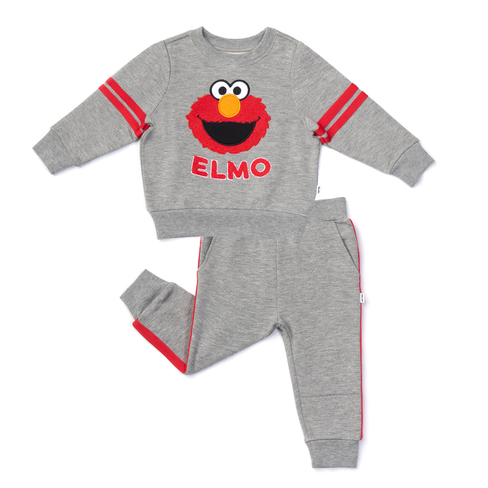 Flat lay image of a Sesame Street Elmo crewneck sweatshirt and jogger set