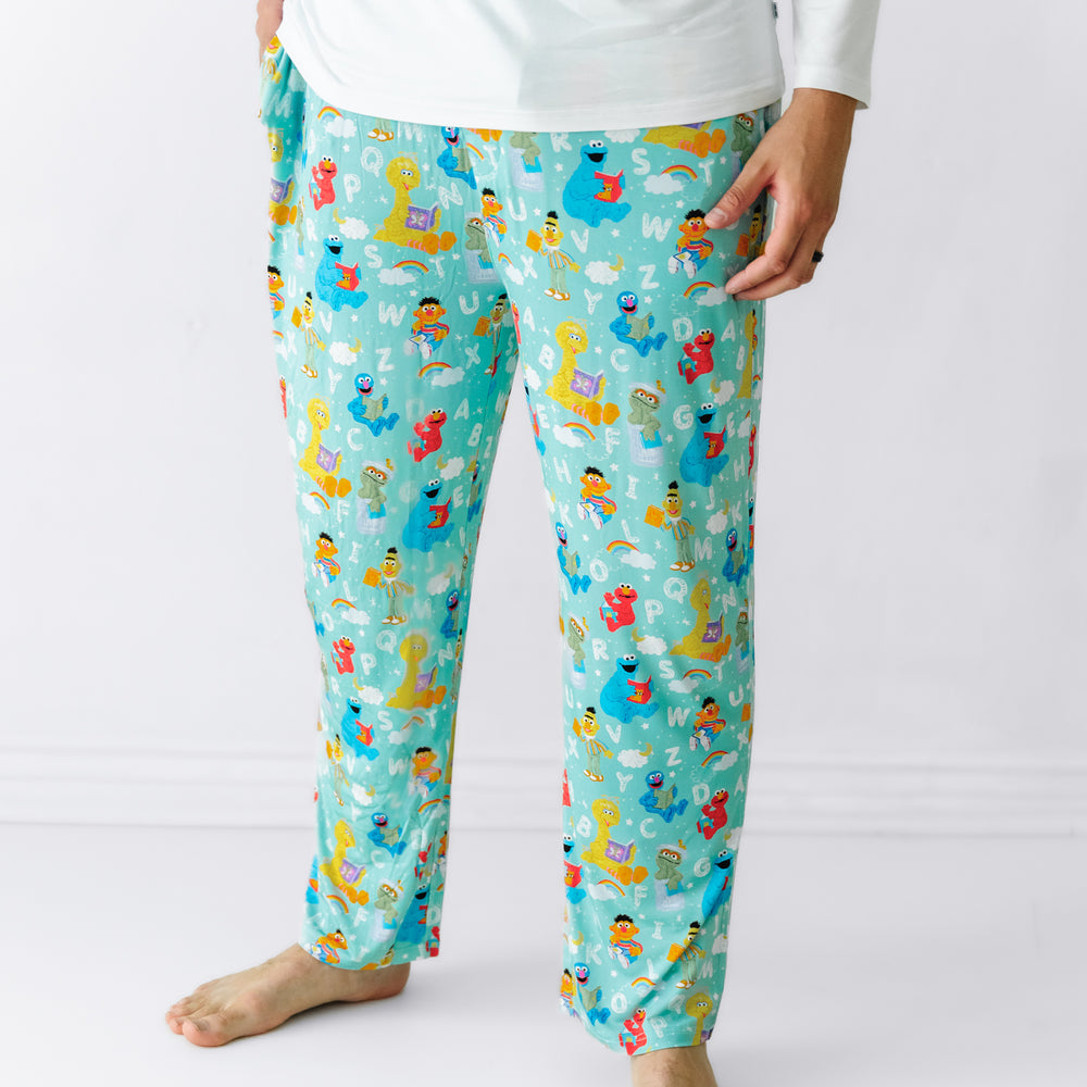 Man wearing Spelling with Sesame Street men's pajama pants