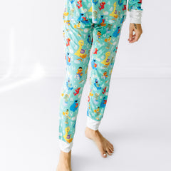Close up image of a woman wearing Spelling with Sesame Street women's pajama pants