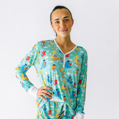 Close up image of a woman wearing a Spelling with Sesame Street women's pajama top