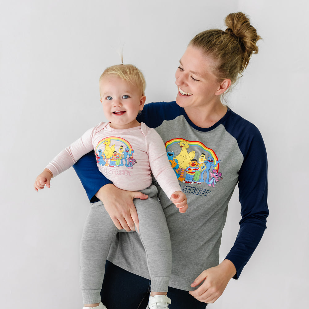 Woman and child wearing Spelling with Sesame Street raglan tees