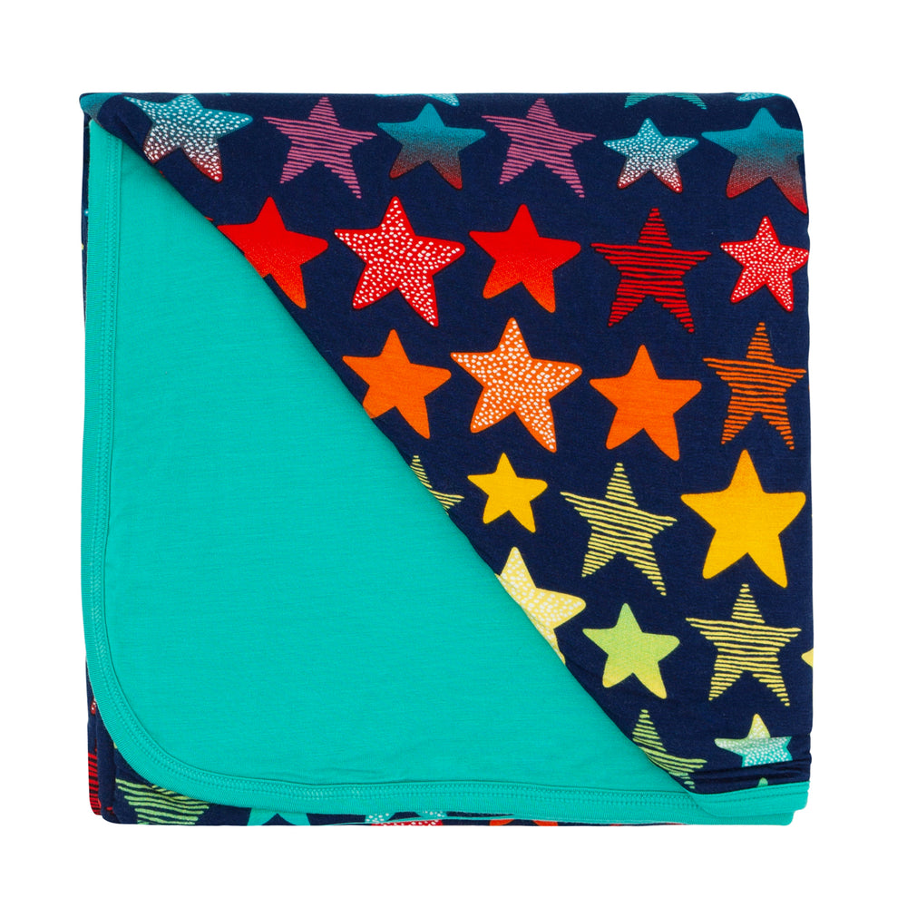 Click to see full screen - Flat lay image of a Shades of Stars large cloud blanket showing the solid teal backing 