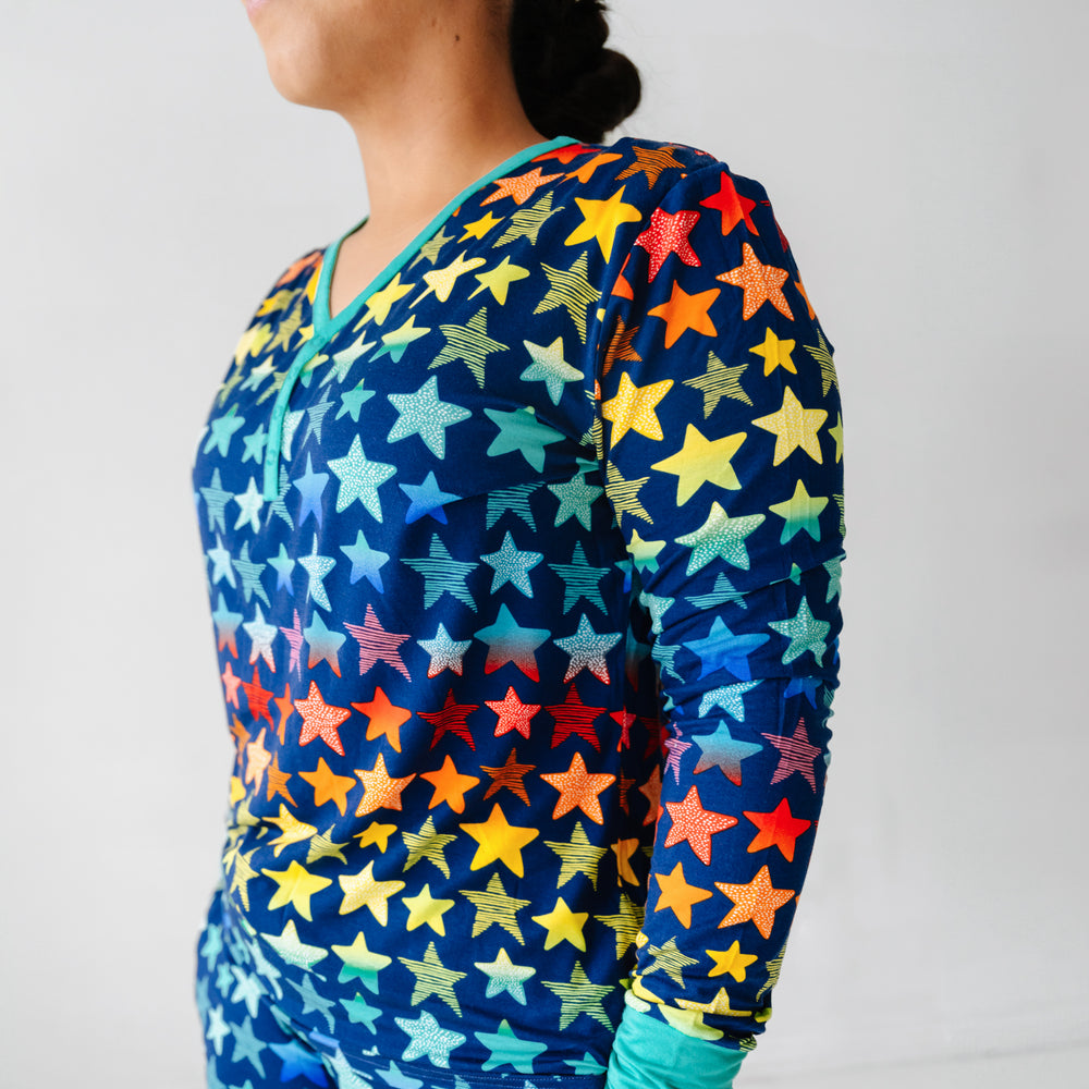 Click to see full screen - Profile view of a woman wearing a Shades of Stars women's pajama top