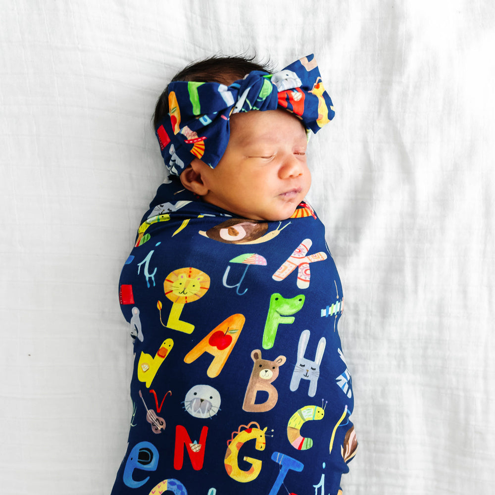 Click to see full screen - SS/HB - Navy Alphabet Friends Swaddle & Headband Set