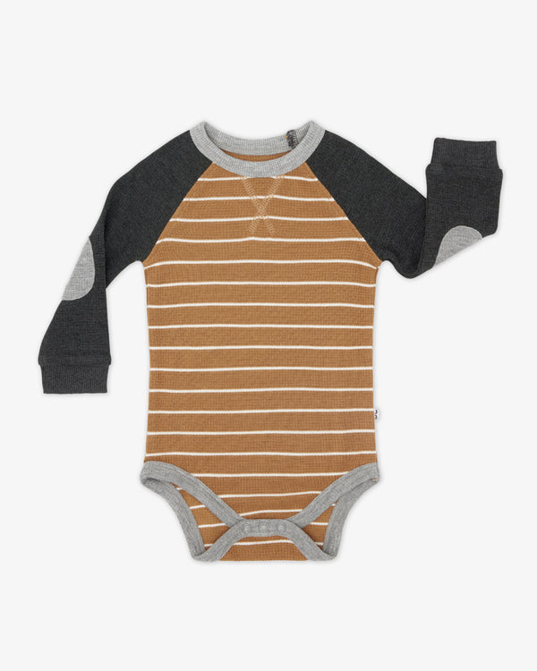 Flat lay of the Cider Stripe Waffle Raglan Bodysuit