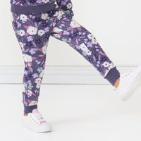 Close up image of a child wearing a Sugar Plum Floral jogger