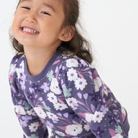 Alternate close up image of a child wearing a Sugar Plum Floral puff sleeve crewneck