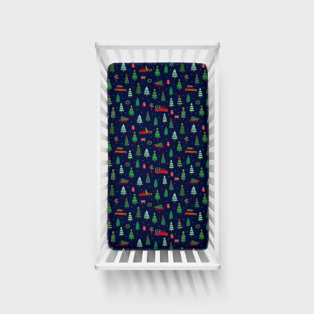 Overhead view of the Navy Tree Traffic Fitted Crib Sheet