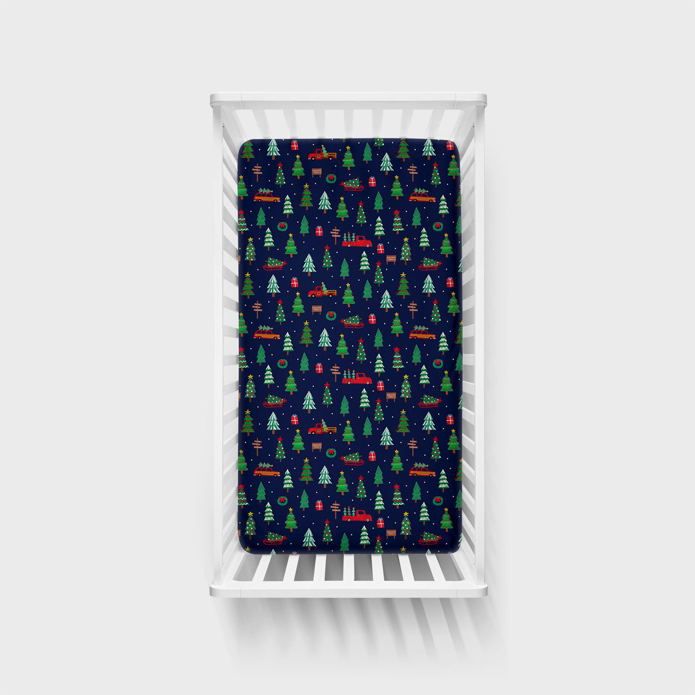 Overhead view of the Navy Tree Traffic Fitted Crib Sheet