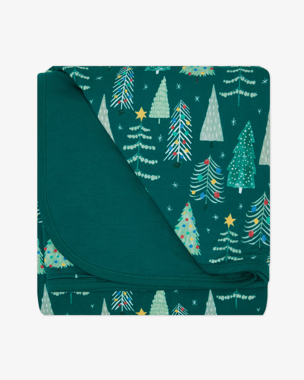 Flat lay of the Twinkling Trees Large Cloud Blanket®