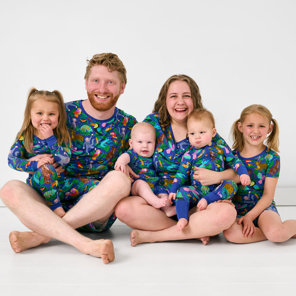 Family of six wearing matching Treetop Tails bamboo pajamas