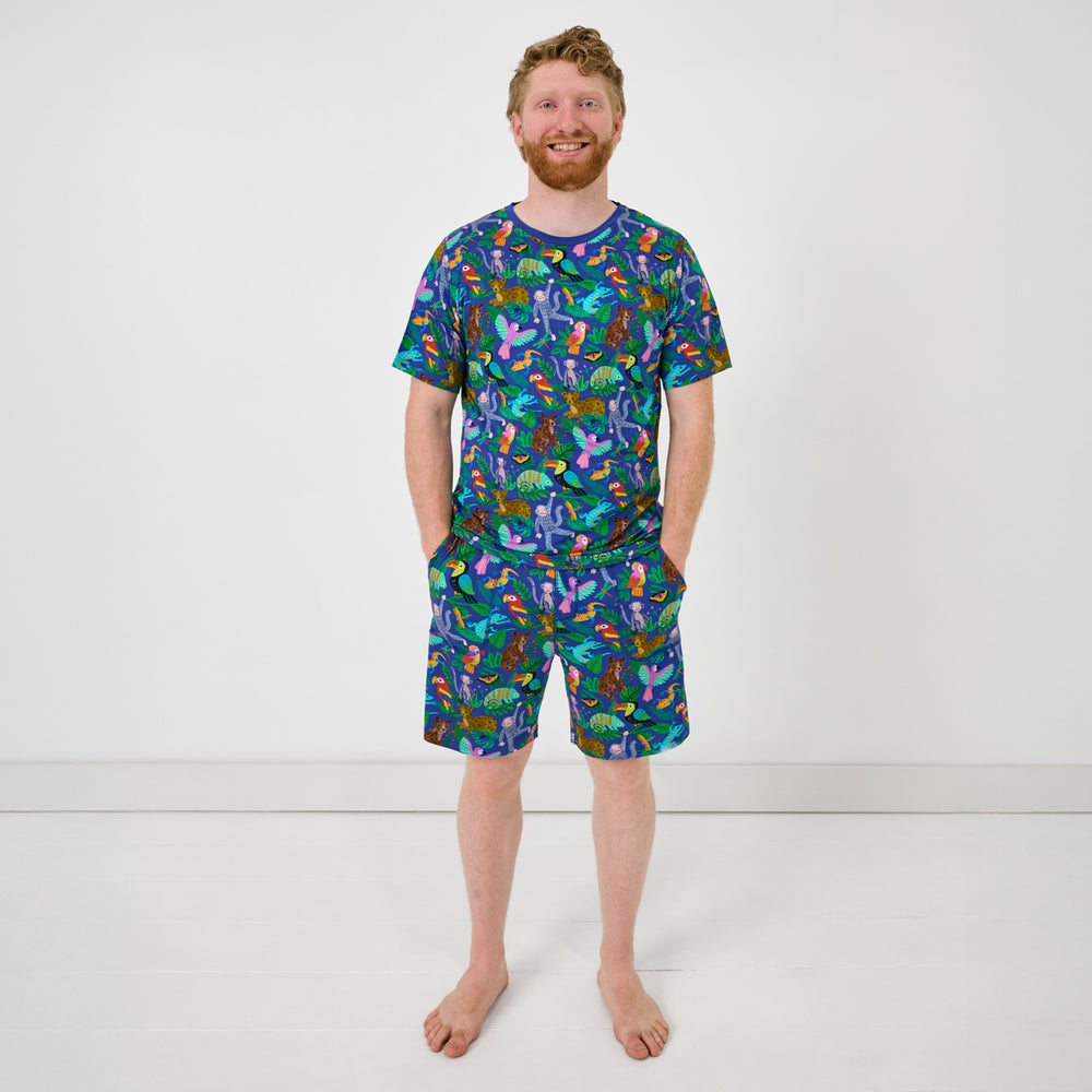 Standing man wearing the Treetop Tails Men's Pajama Shirt and Shorts