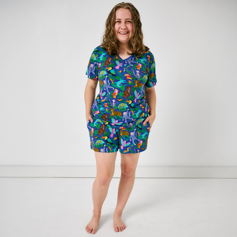 Standing woman wearing the Treetop Tails Women's Pajama Shorts and Shirt