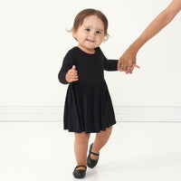 Alternate image of a child holding a parent's hand wearing a Black ribbed twirl dress with bodysuit