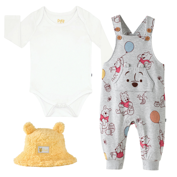 Soft White Bodysuit, Up, Up And Away Overall, and Winnie The Pooh Sherpa Bucket Hat