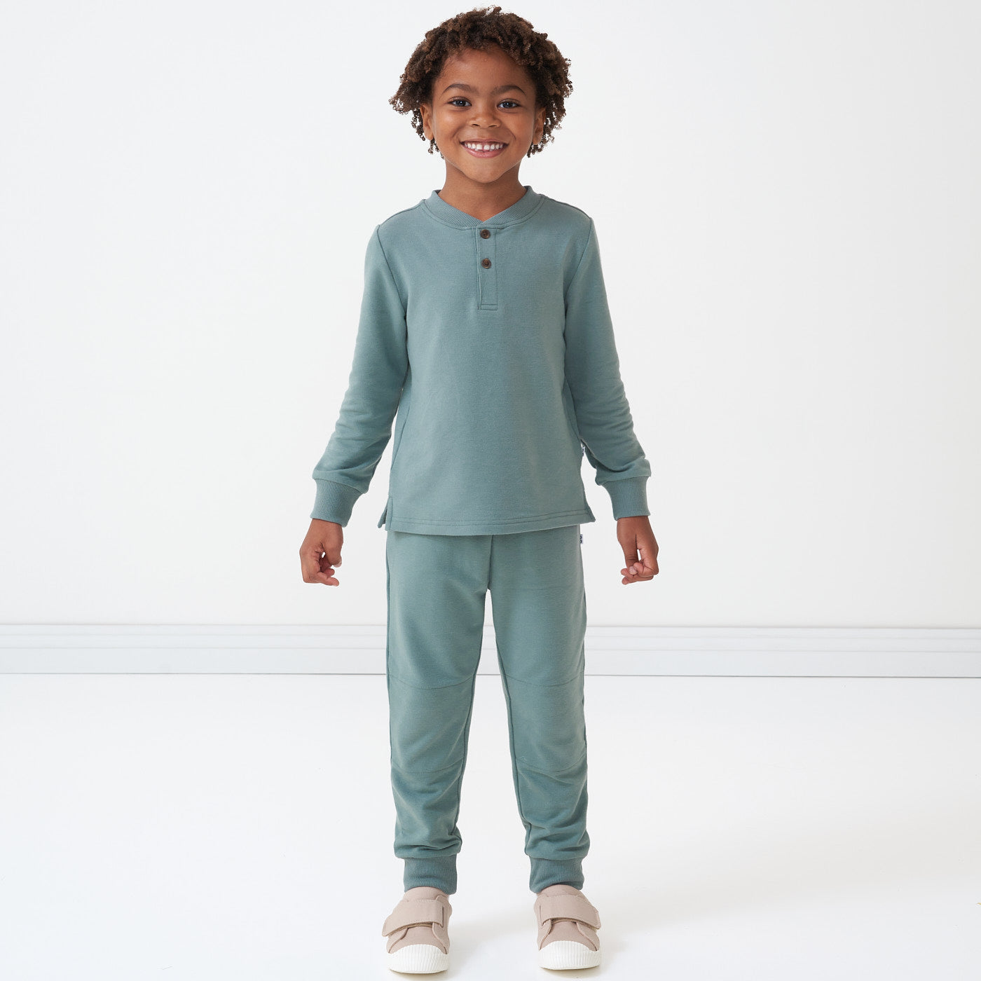 Child wearing a Vintage Teal henley tee and matching joggers